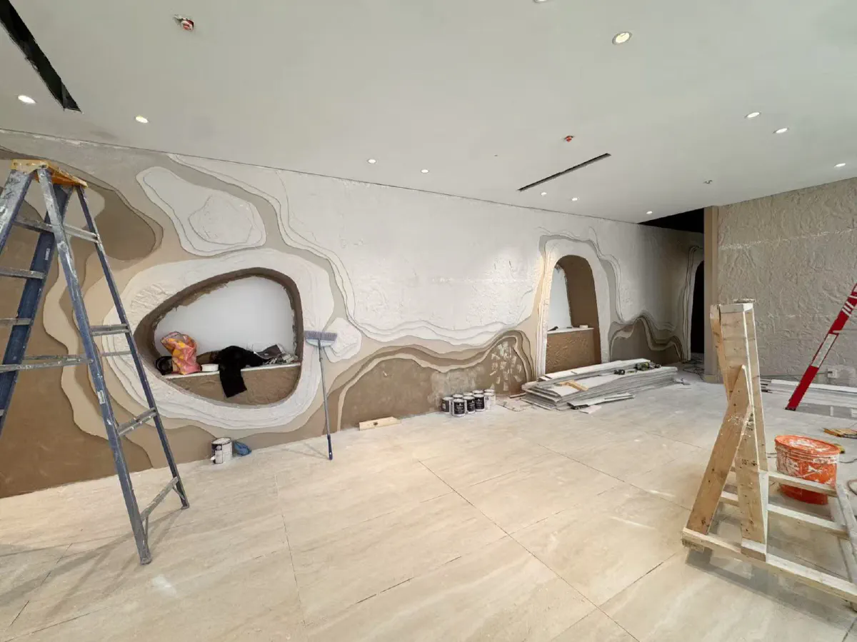 The sculpted feature wall, layered by hand